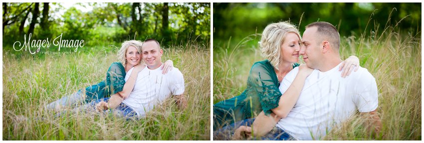 engaged couple sitting in tall grass