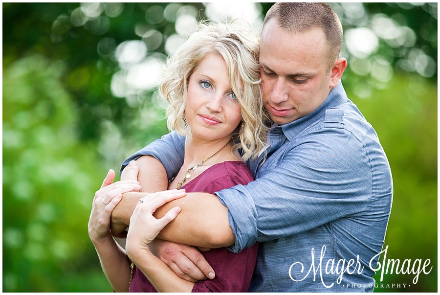 engagement session couple in maroon and grey love serious pose