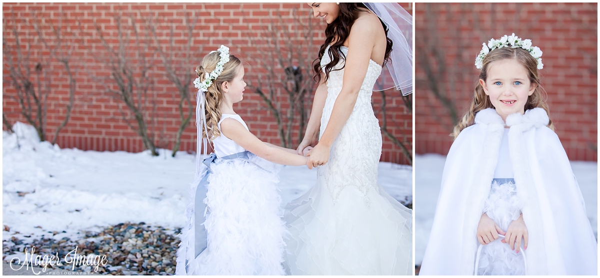 flower girl holding hands with bride winter jacket