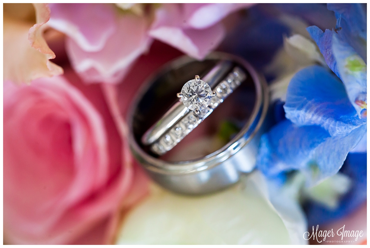 ring shot wedding bands on bouquet