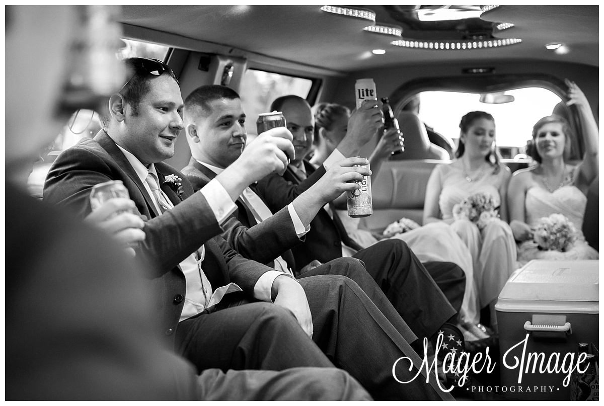 bridal party toasting in limo