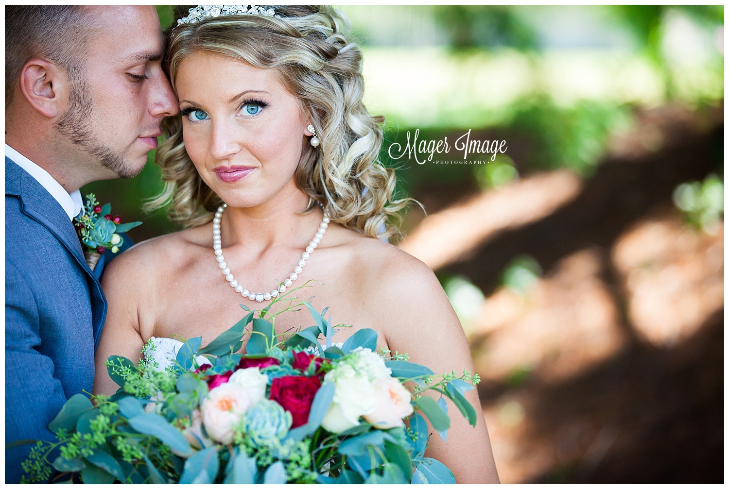 blue eyed bride pose with groom