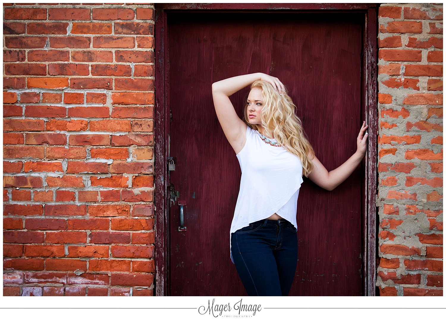 blonde girl pose brick door