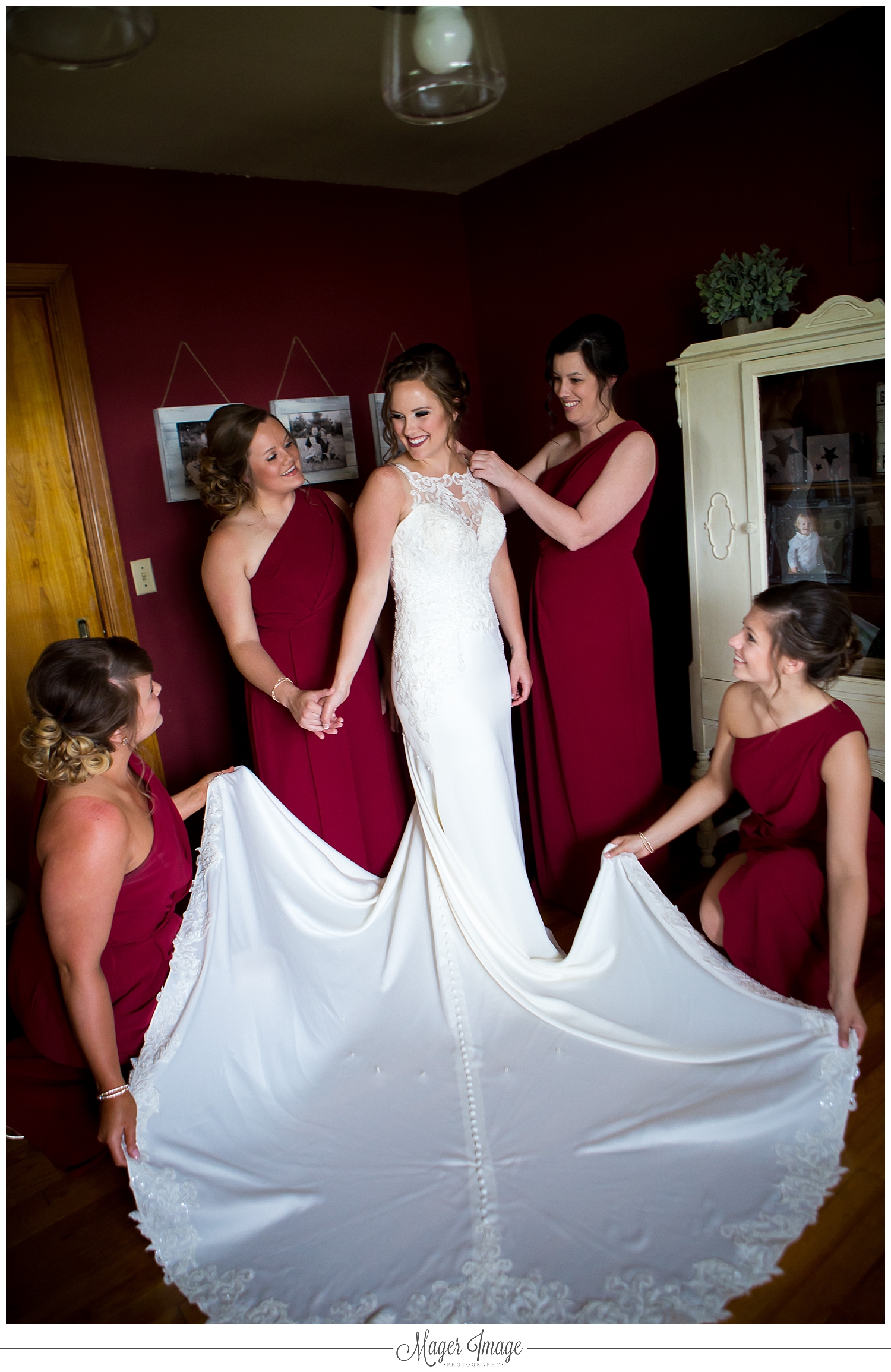 bride dressing bridesmaids surrounding
