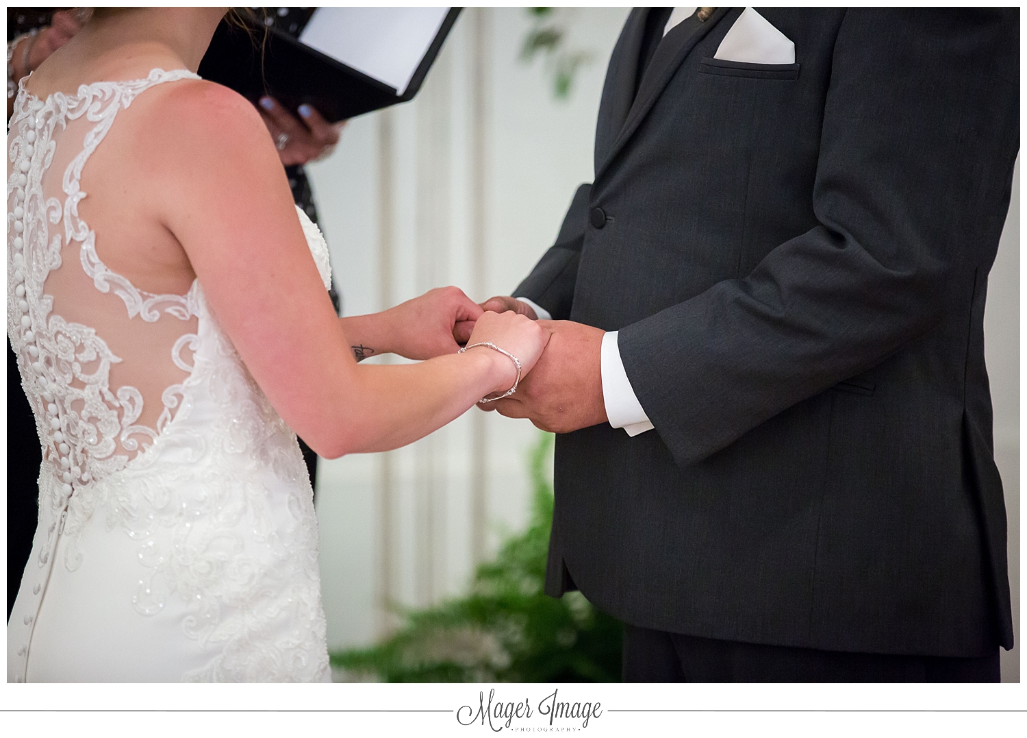 bride groom holding hands marriage wedding chapel church dress tux love