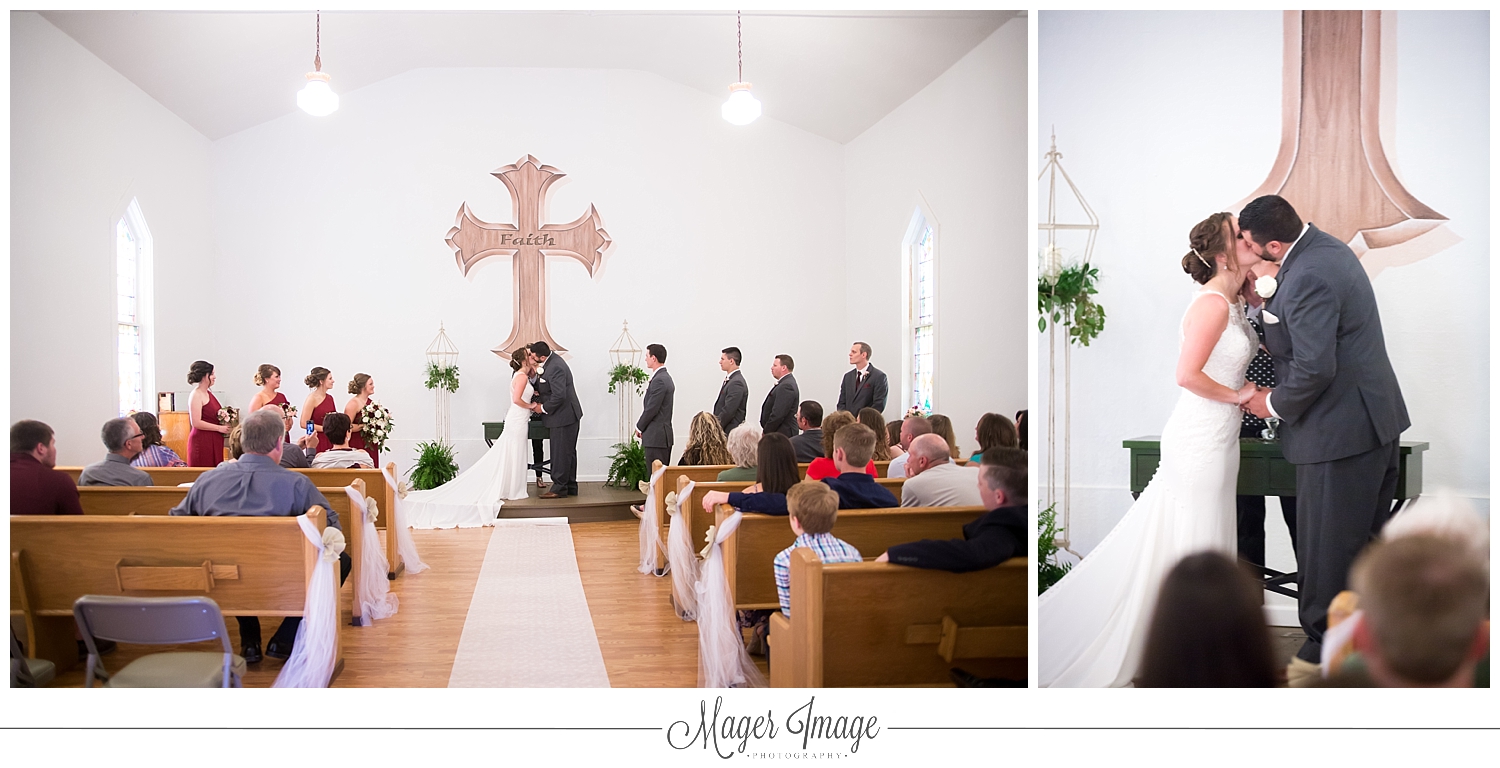 bride groom kiss chapel church cross love guests pews seating
