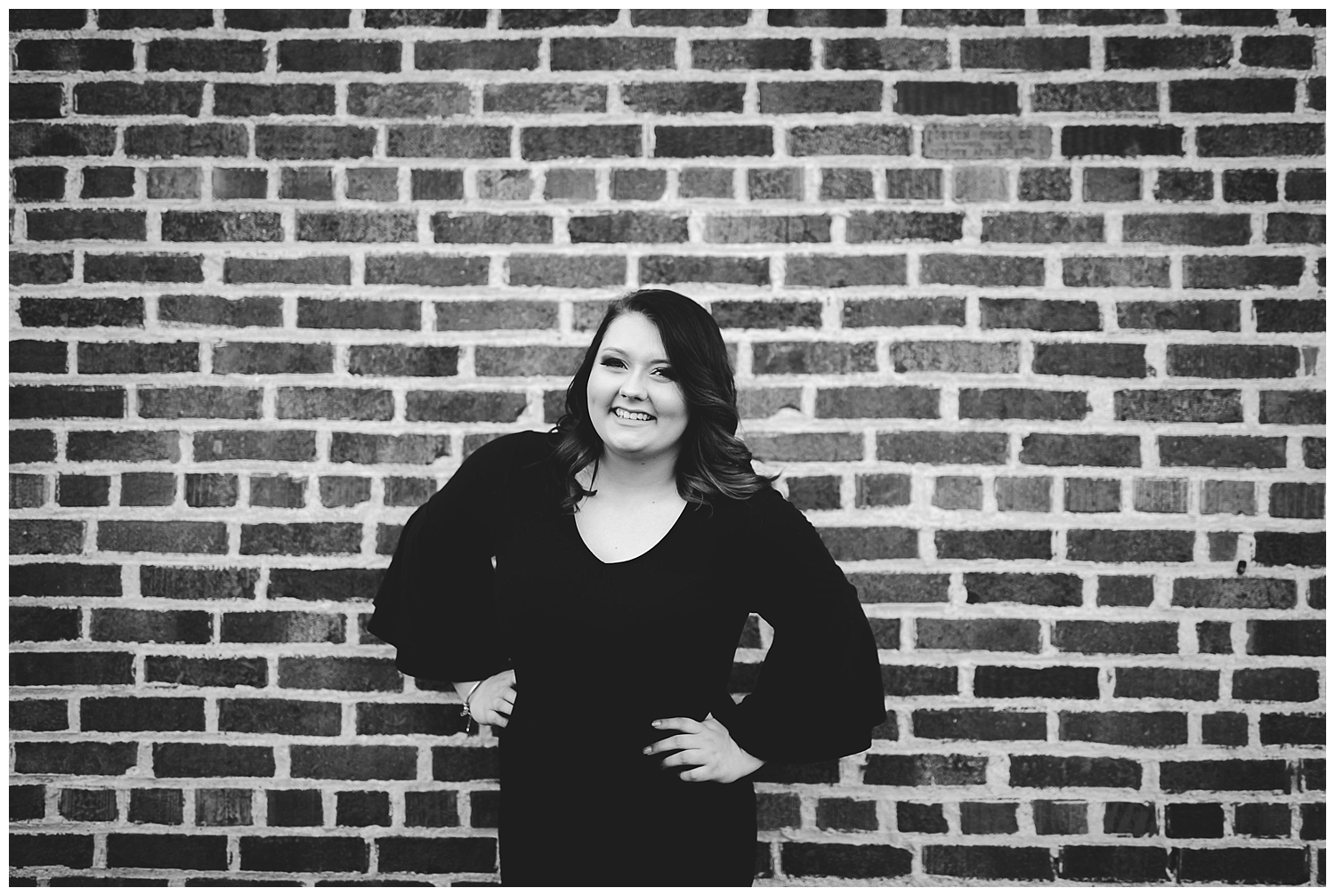 black and white brick wall girl