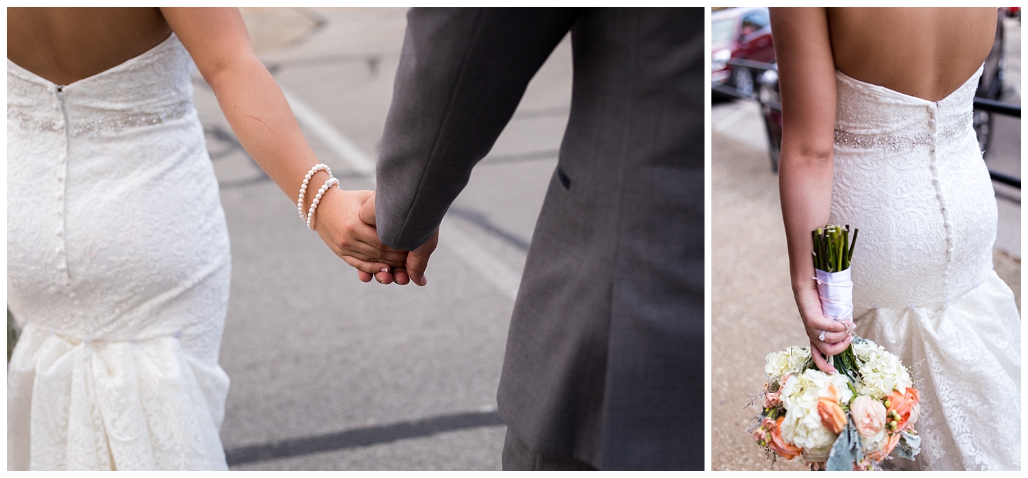 wedding day details back of dress holding hands