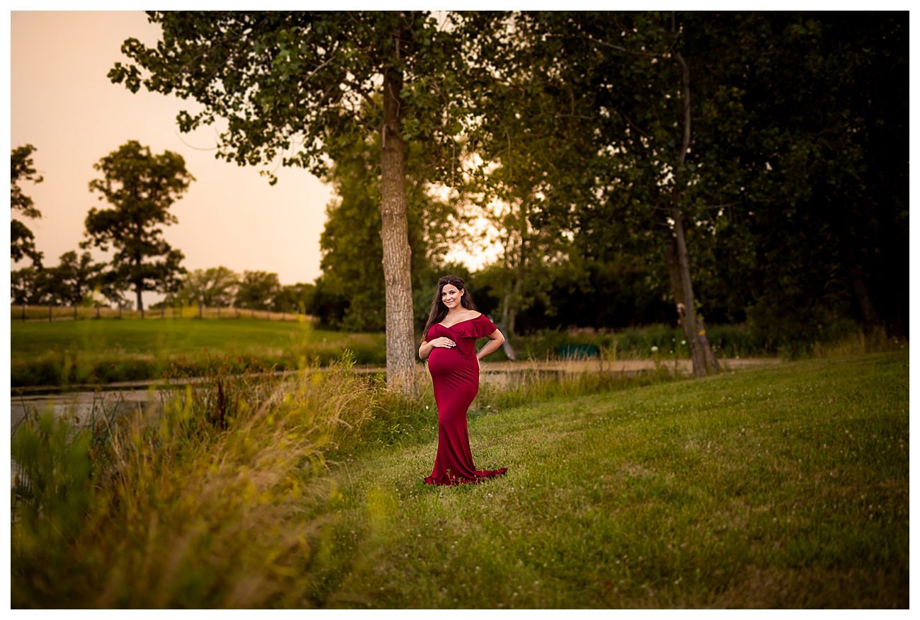 creekside maternity session red maxi dress