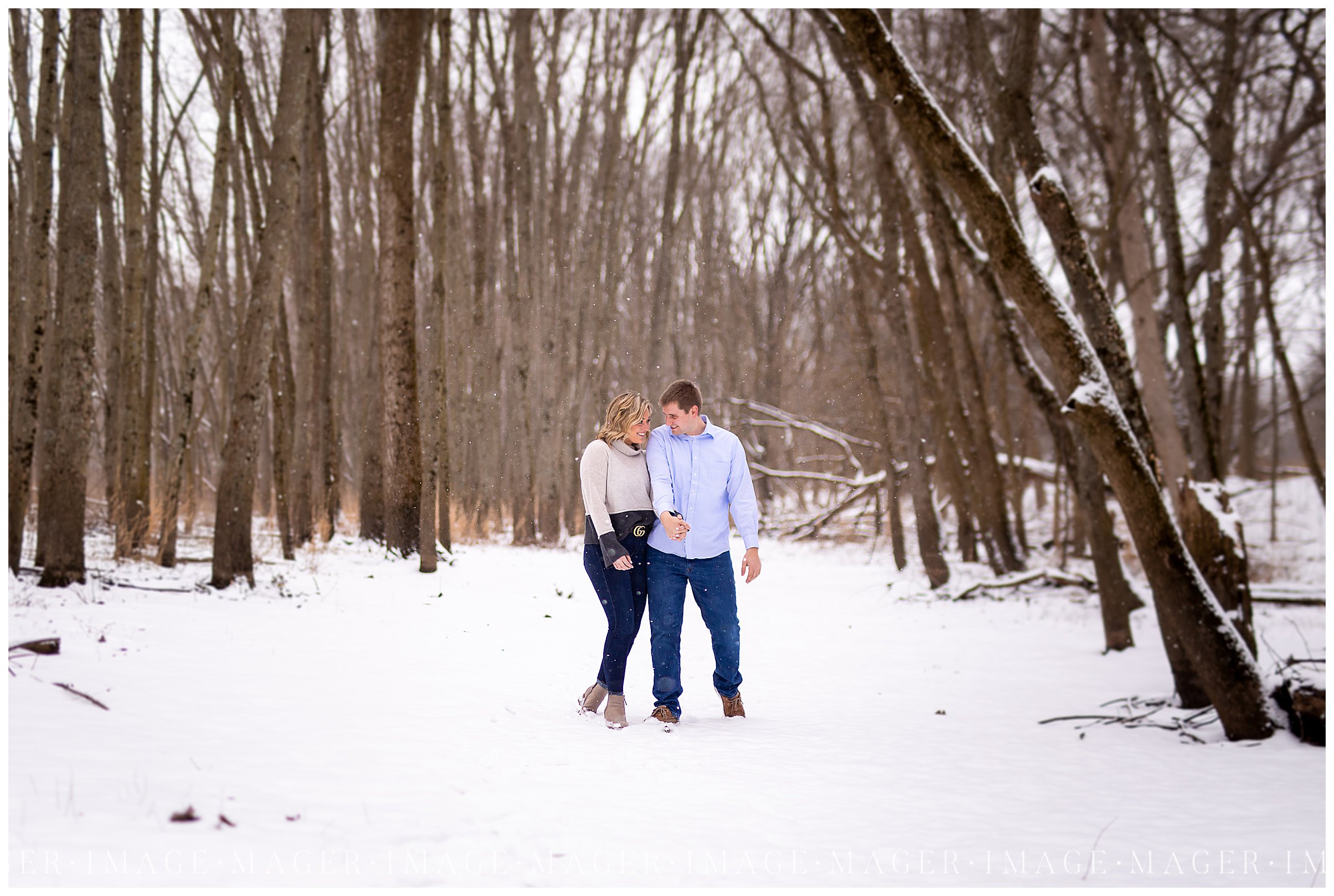 wooded snow winter engagement session