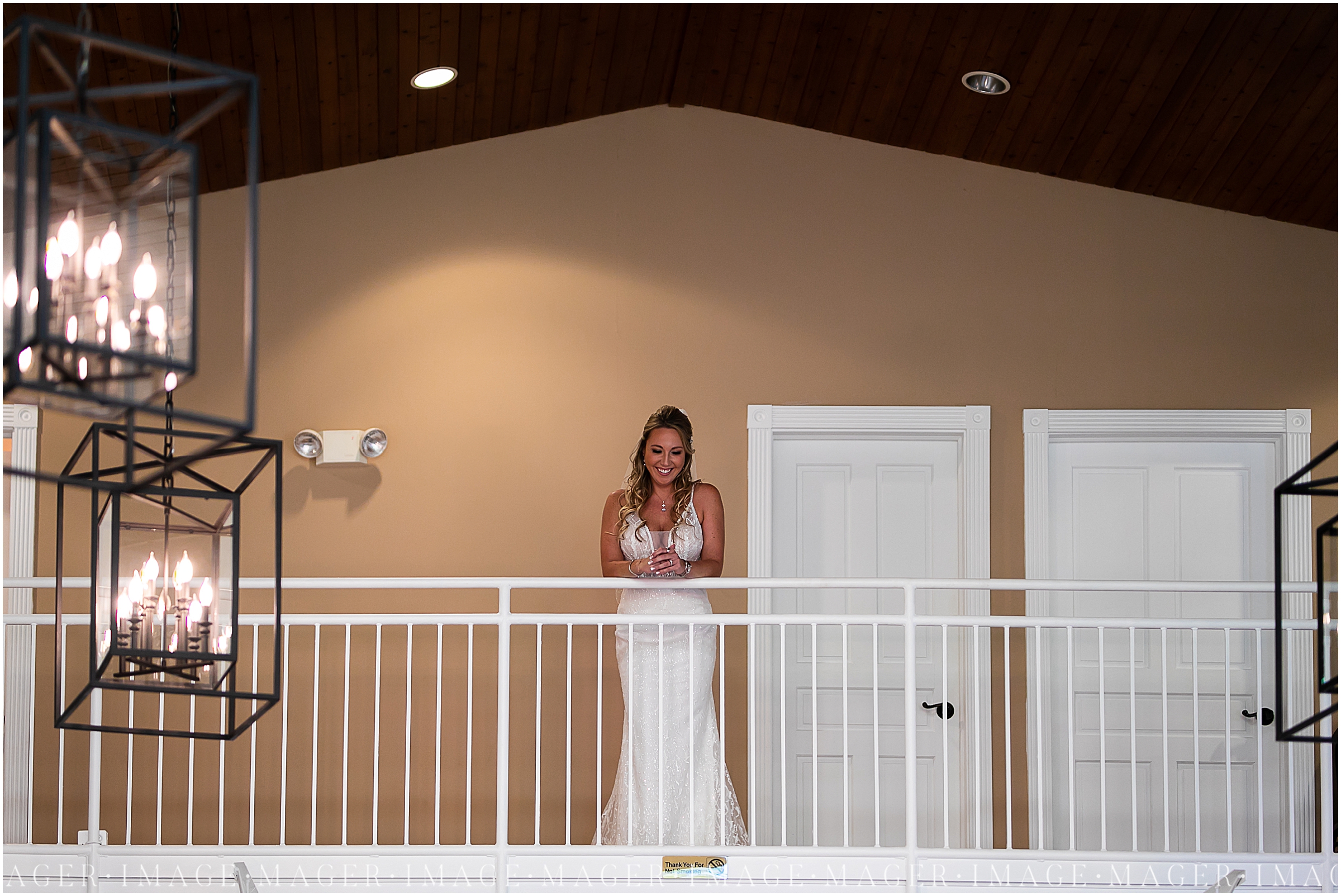 bride looking over balcony, wedding day