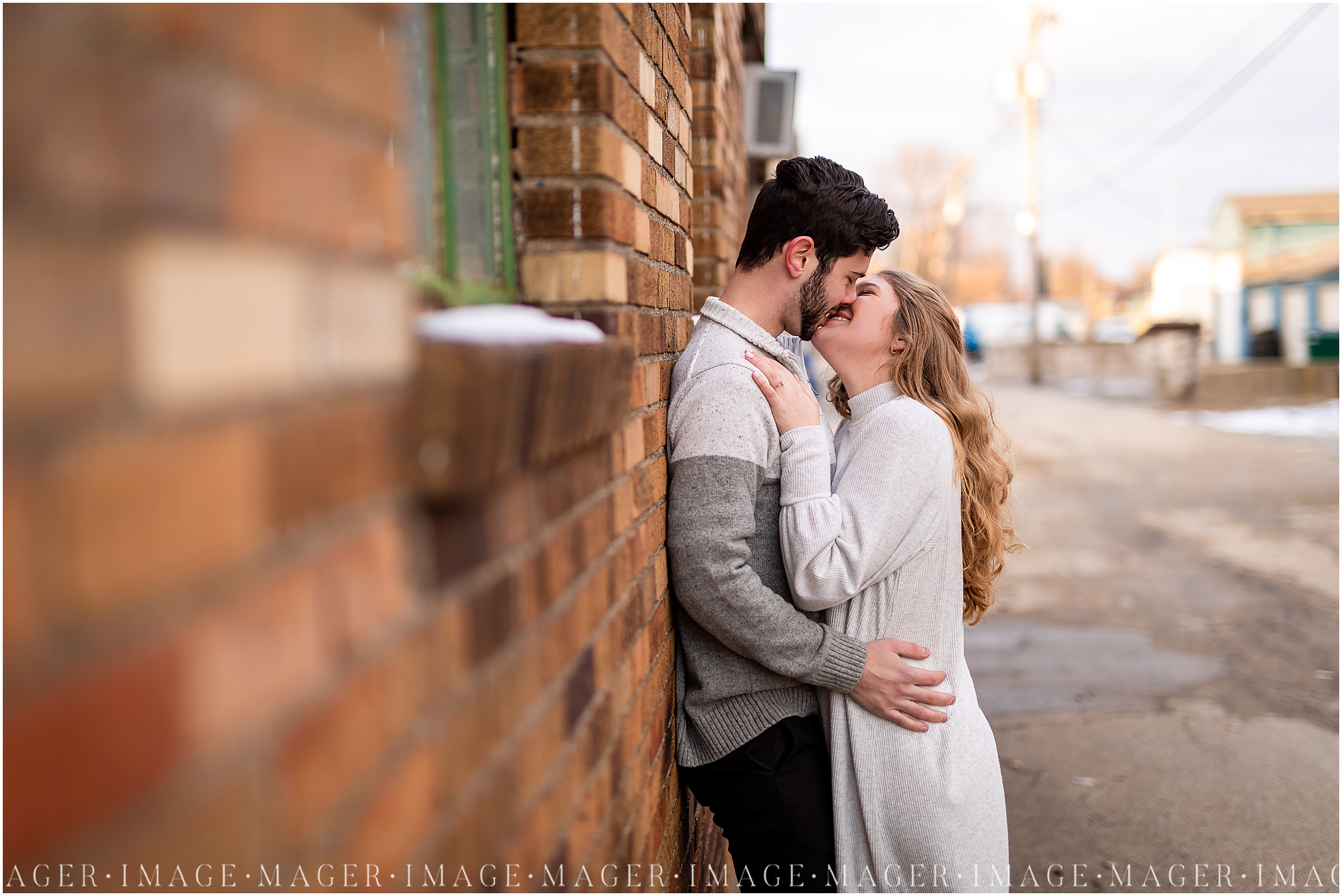 brick wall downtown champaign winter engagement session