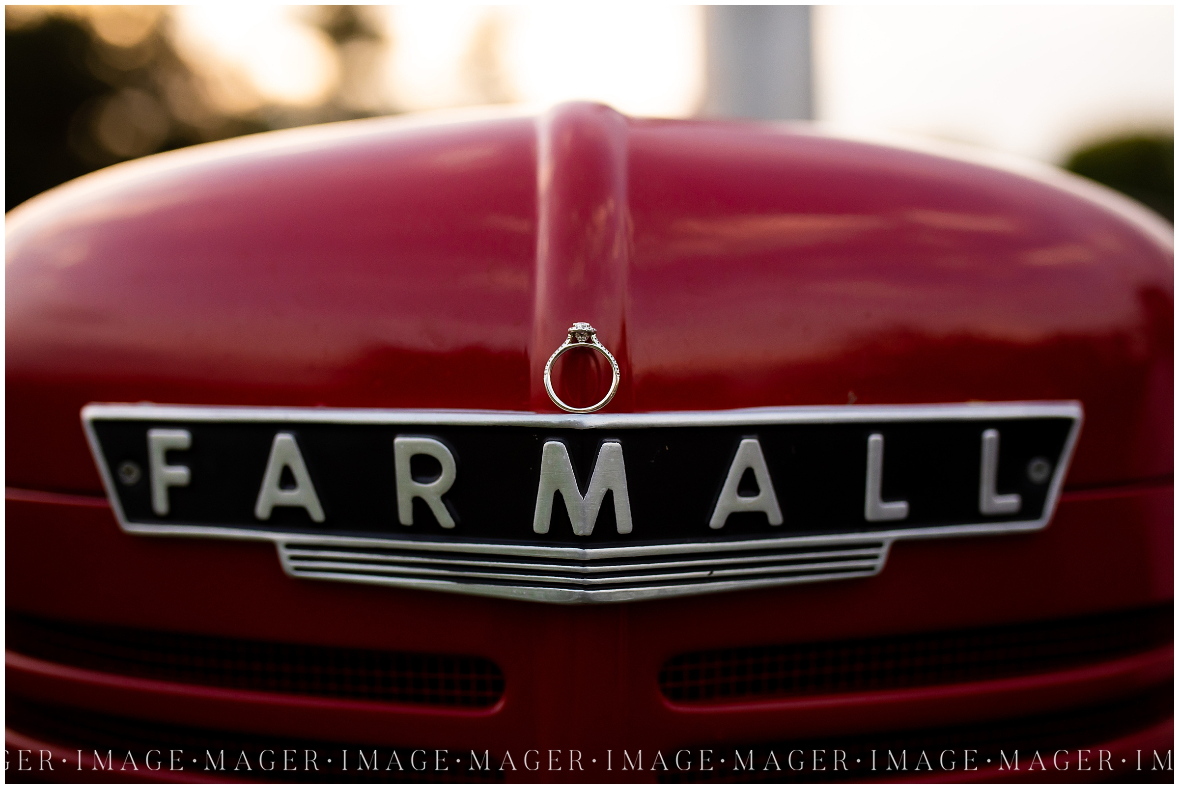 Ring shot on the badge of an old Farmall tractor