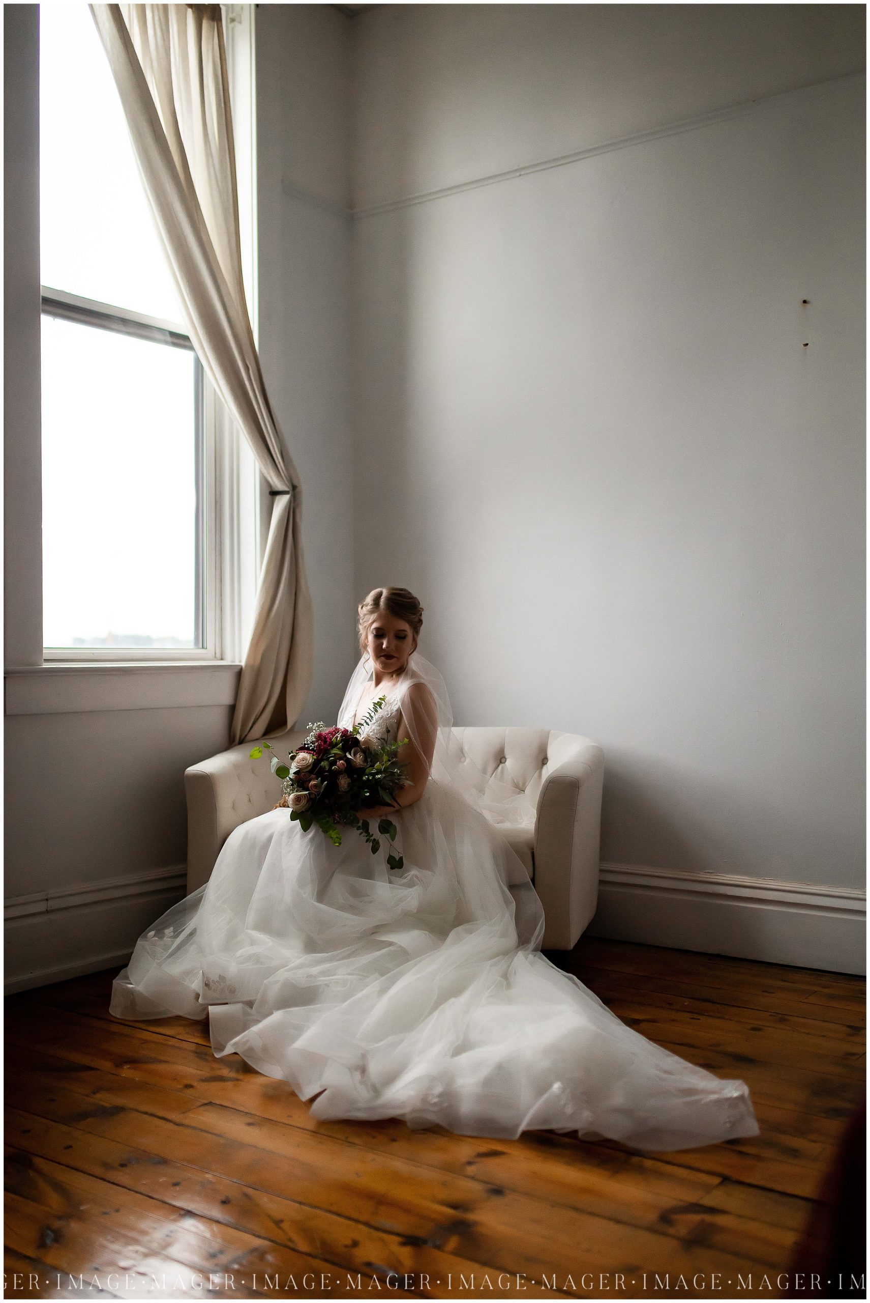 bride sitting in white chair, davinci lace bridal gown