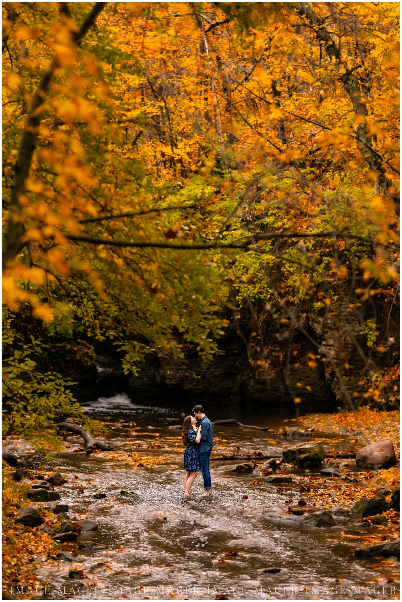 barefoot couple staning in water in fall chicago