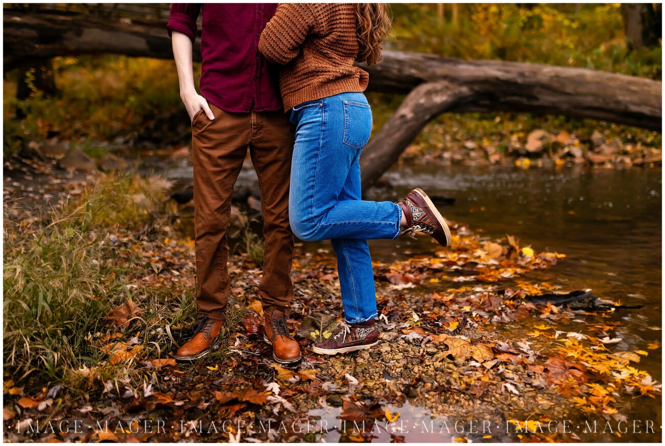couple posing in water leaves perfection