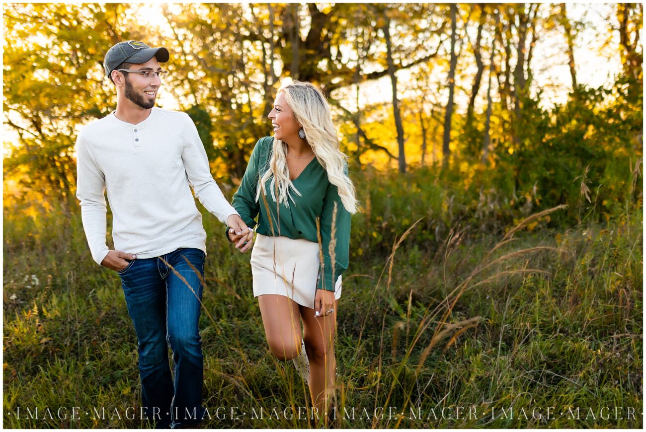 gorgeous sunlit engagement session field tall grass