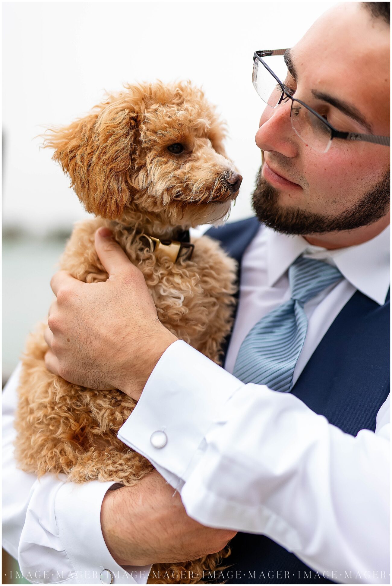 groom with puppy fur baby