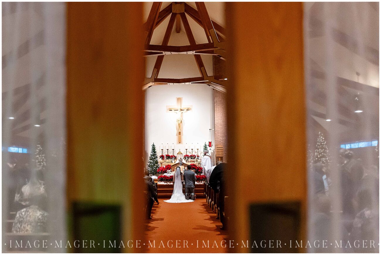 catholic church wedding ceremony christmastime illinois photographer