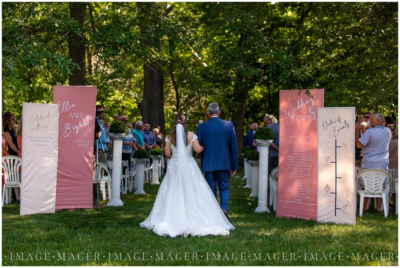blush and navy outdoor summer ceremony at crooked creek whitetail estate