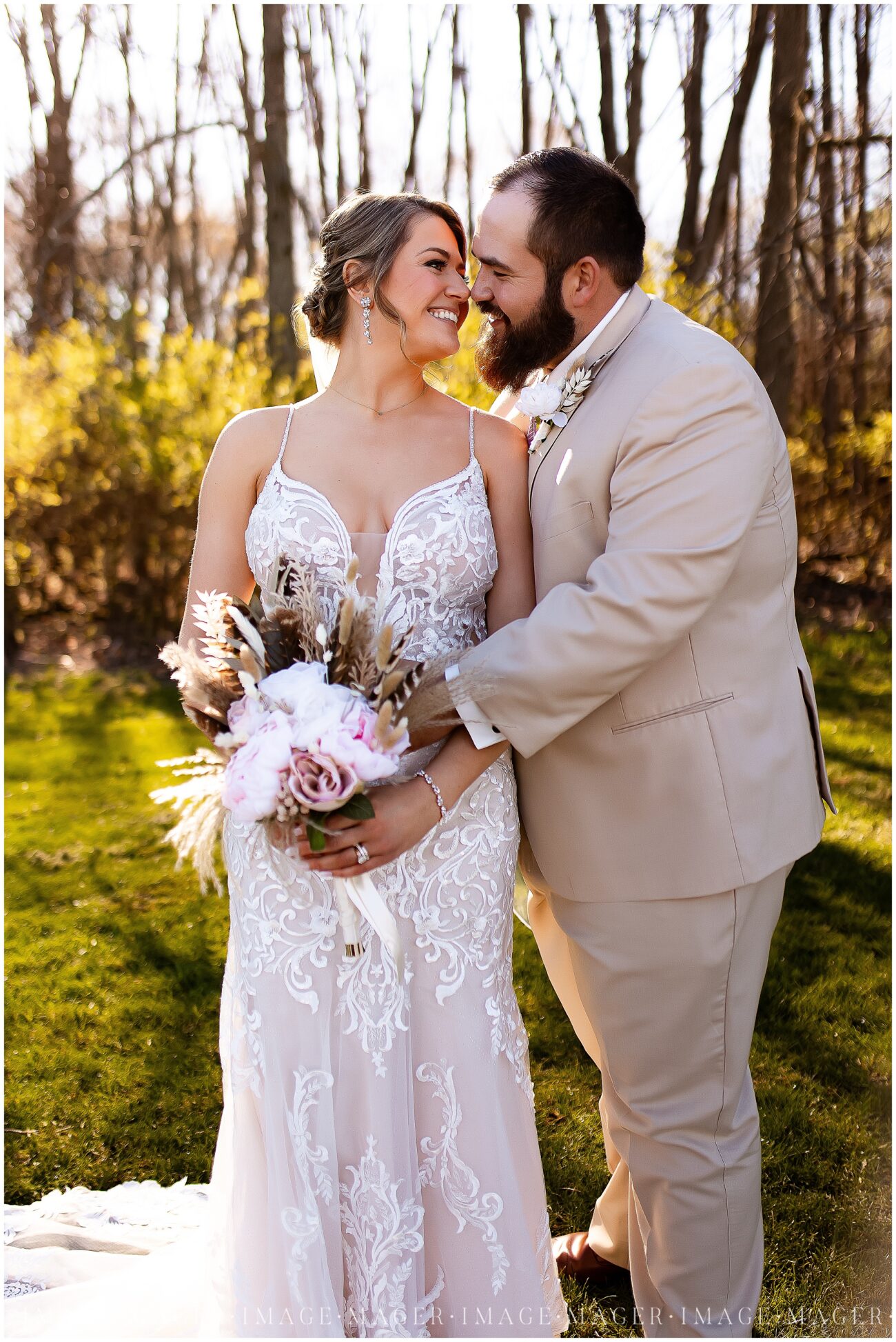 A small town wedding for Casey and Adam. A close up portrait of Casey and Adam outdoors in front of some green trees.

Saint John the Baptist Catholic Church, L'erable, IL. 

Photo taken by Mager Image Photography.