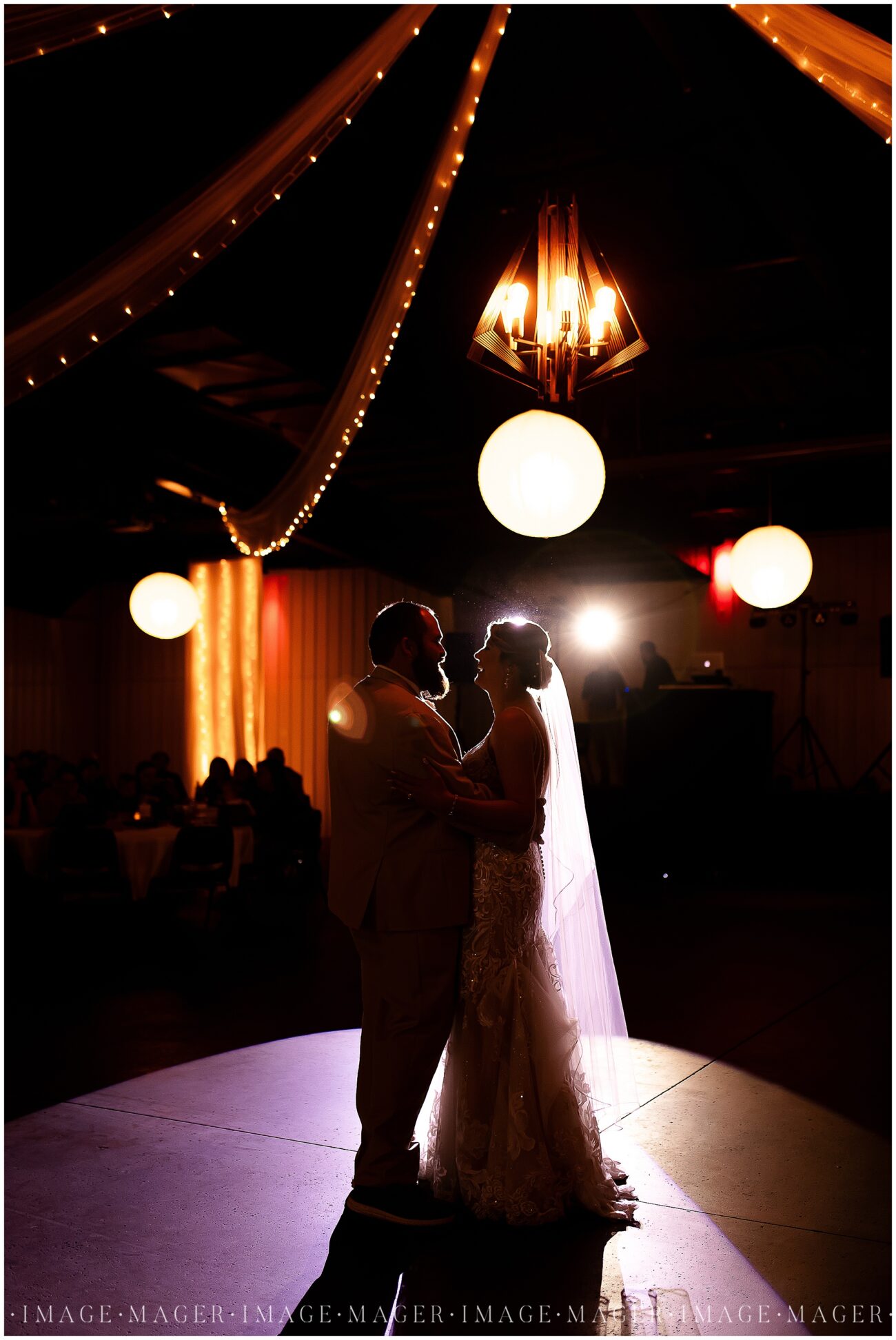 A small town wedding for Casey and Adam. The bride and groom share a first dance under glowing lights at their large wedding reception at the Kankakee County Fairgrounds.

Kankakee County Fairgrounds, Kankakee, IL.

Photo taken by Mager Image Photography.