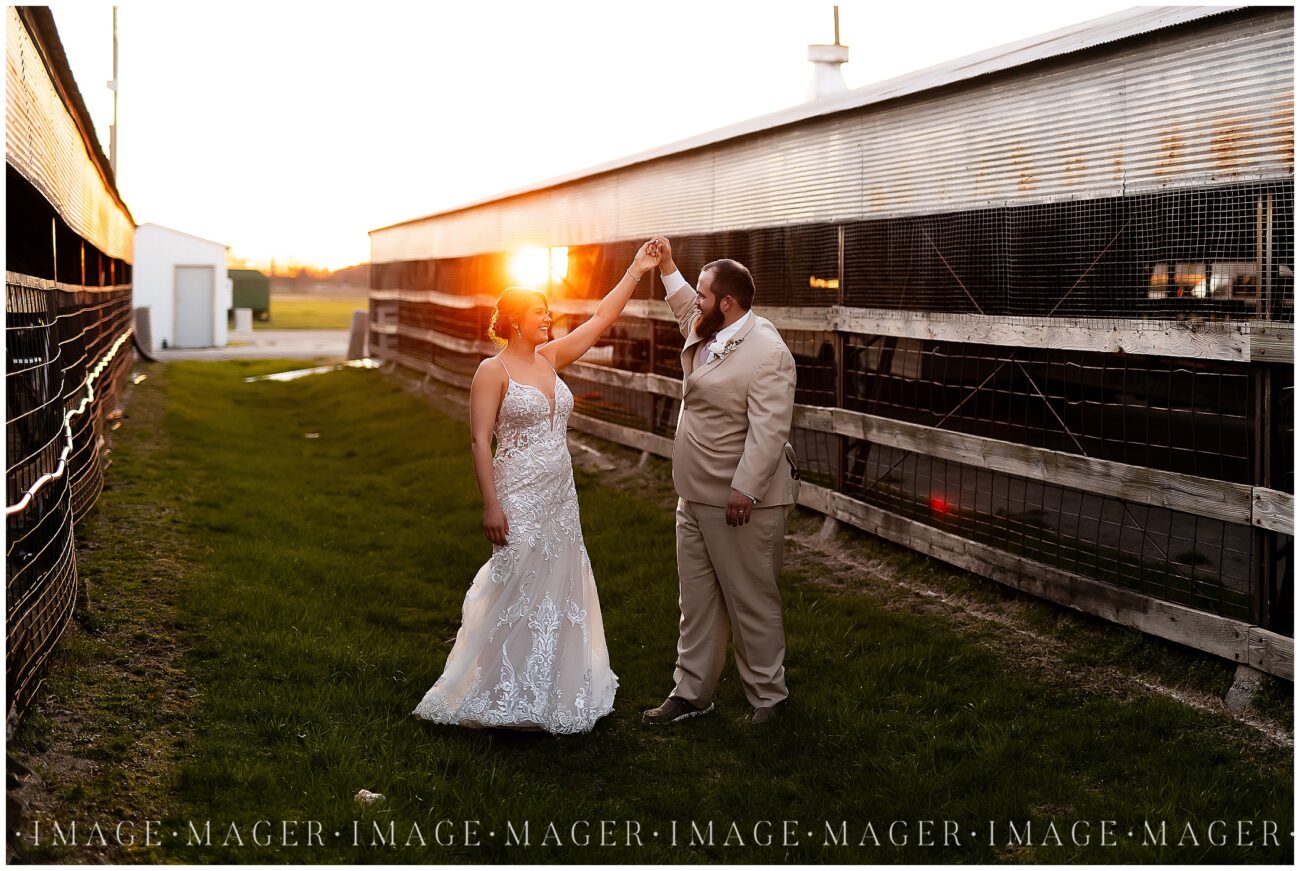 A small town wedding for Casey and Adam. The bride and groom share a dance for a portrait in a pathway near a barn at the Kankakee County Fairgrounds.

Kankakee County Fairgrounds, Kankakee, IL.

Photo taken by Mager Image Photography.