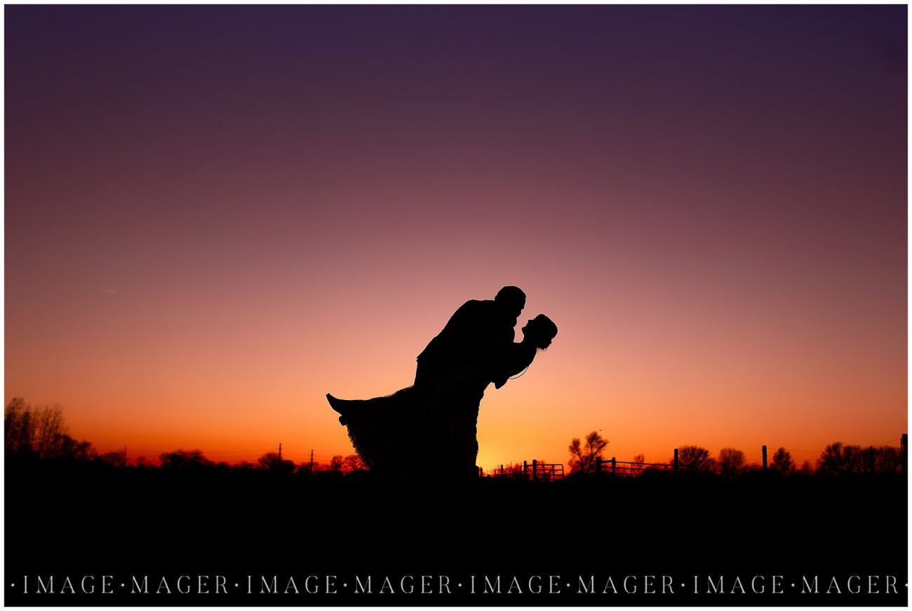 A small town wedding for Casey and Adam. A sunset silhouette image of the groom dipping his bride just before going in for a kiss.

Kankakee County Fairgrounds, Kankakee, IL.

Photo taken by Mager Image Photography.