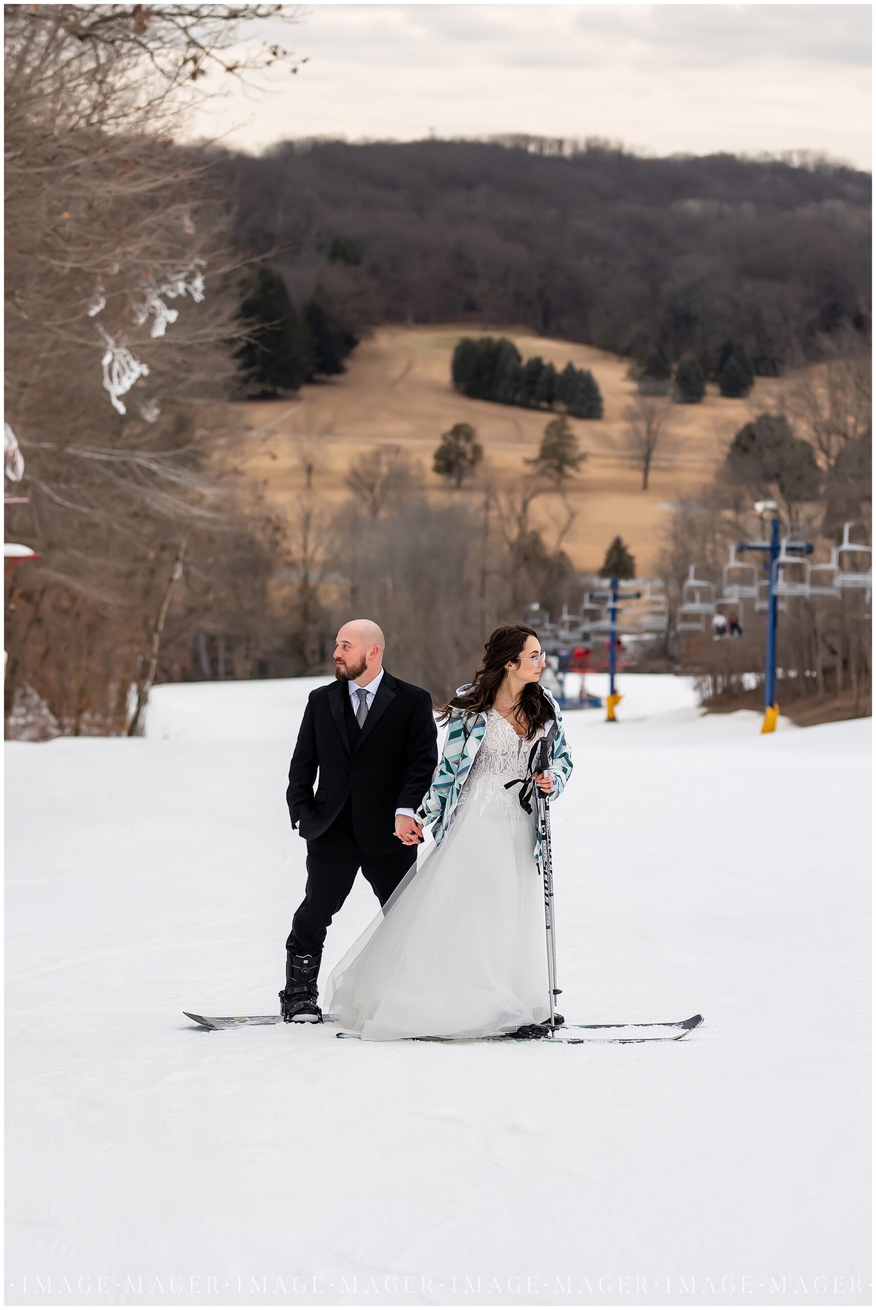 alpine valley ski resort snowboarder wedding portraits in snow slopes